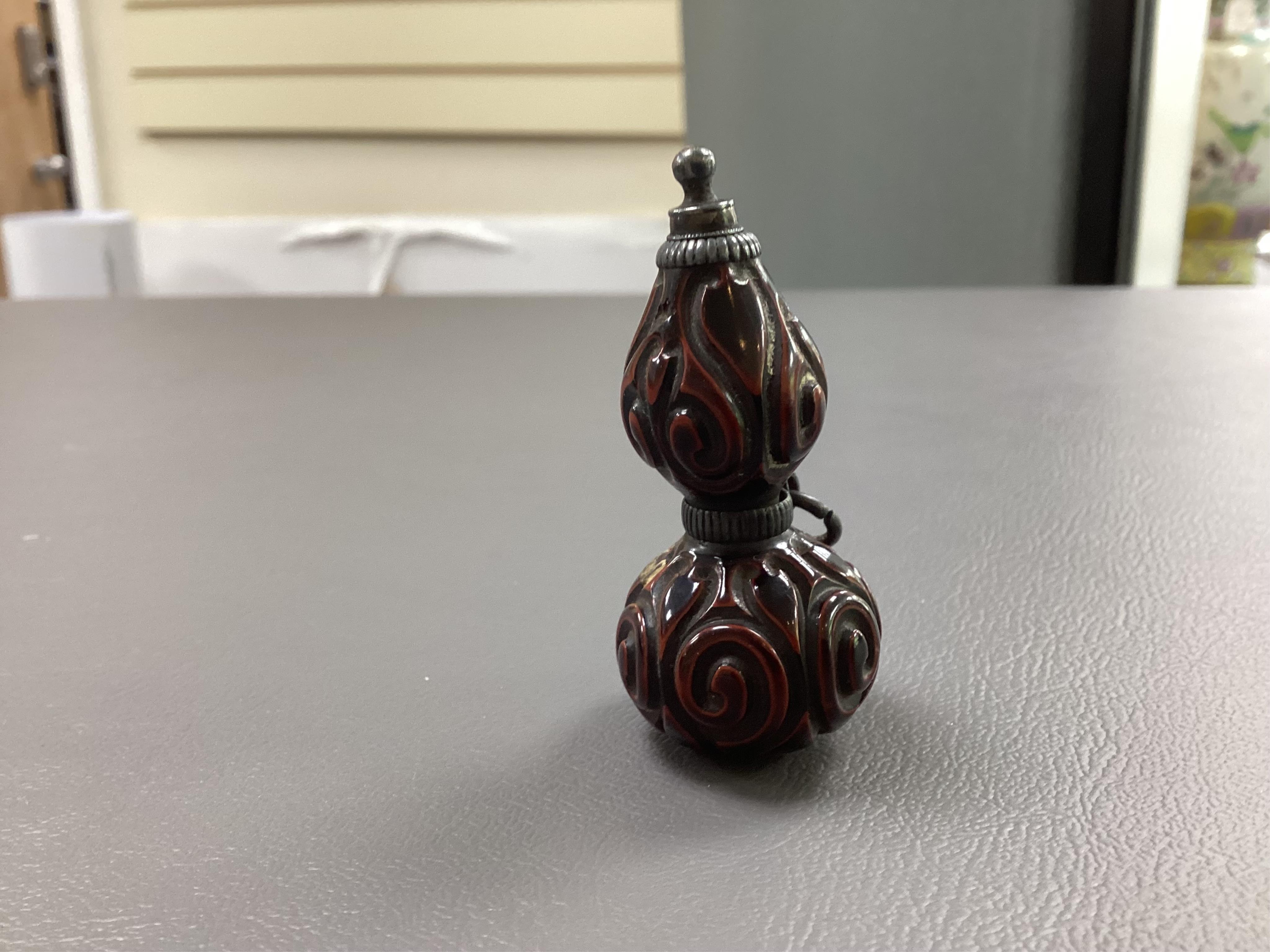 A Japanese guribori lacquer double gourd shaped netsuke, Edo period, late 18th/early 19th century